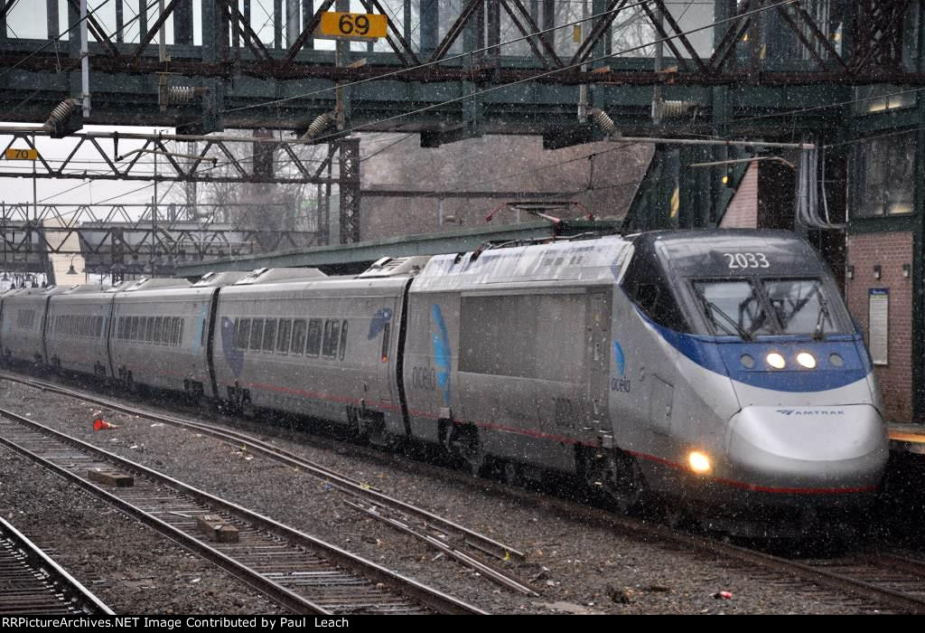 Acela Express cruises west through the station